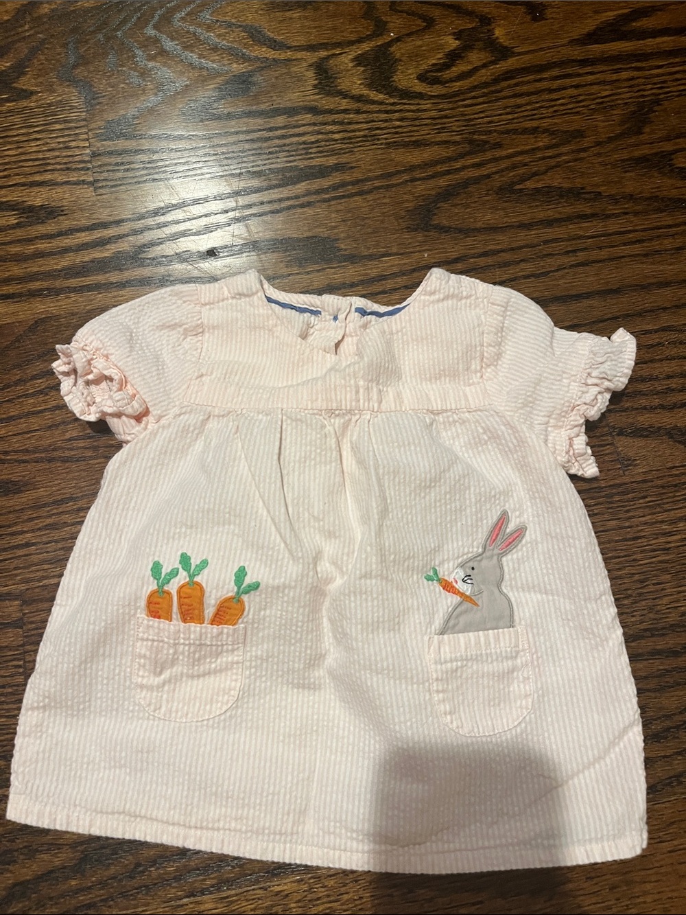 Pink seersucker baby dress with bunny appliqué detail